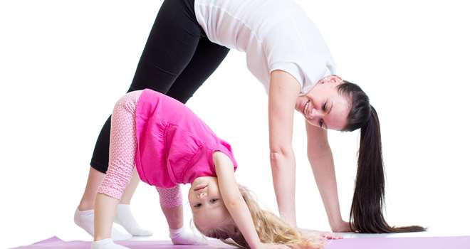 Mother-and-child-doing-exercis-87875666.jpg