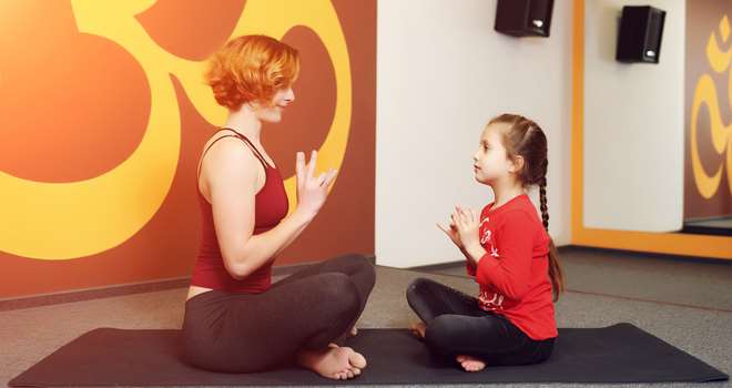 Mother-and-child-yoga-practice-82189127.jpg
