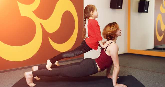 Mother-and-child-yoga-practice-82189379.jpg