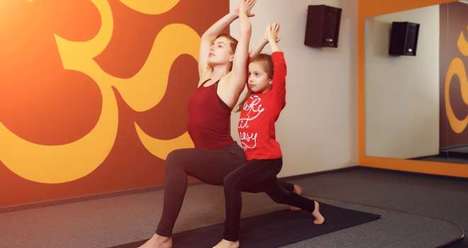 Mother-and-child-yoga-practice-82189571.jpg